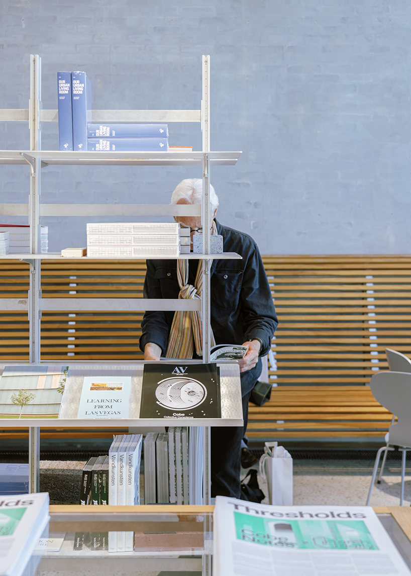a bookstore inside cobe copenhagen: a material library of architecture, cities, and ideas - 4