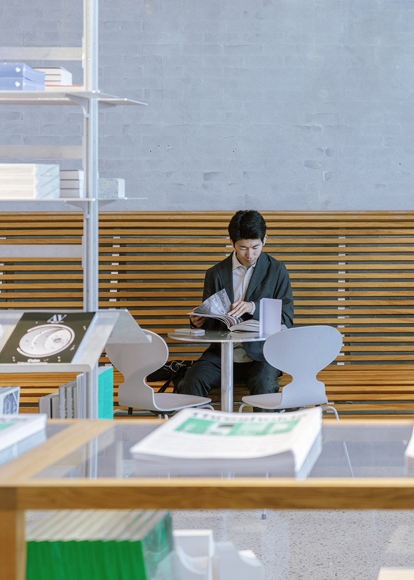 a bookstore inside cobe copenhagen: a material library of architecture, cities, and ideas - 7