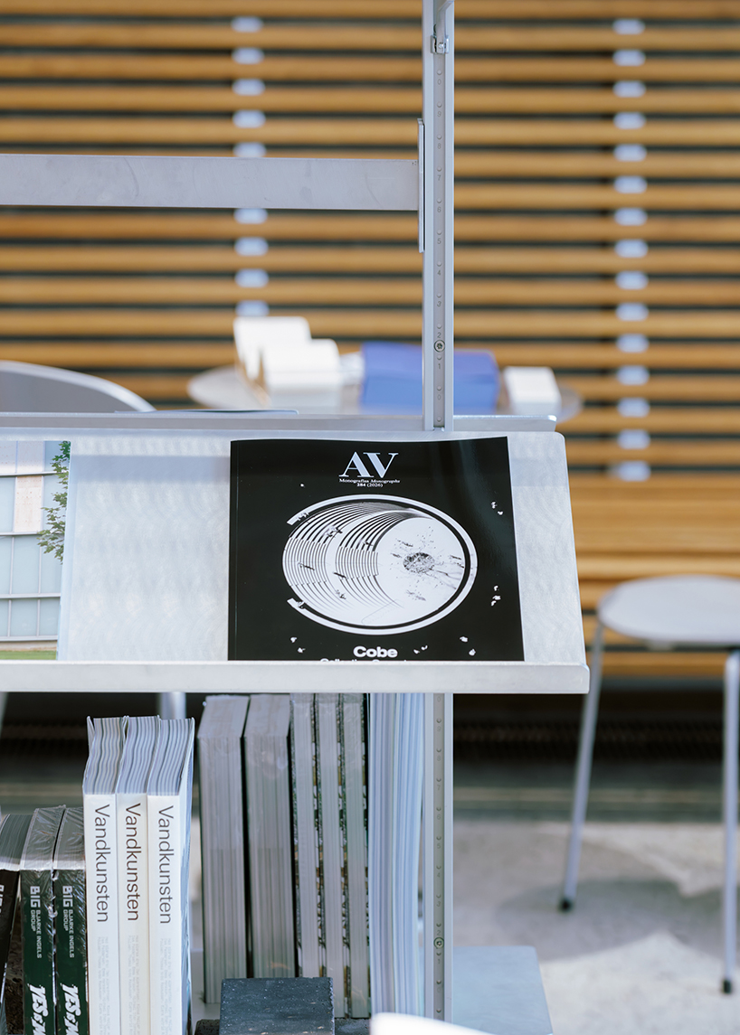 a bookstore inside cobe copenhagen: a material library of architecture, cities, and ideas - 8