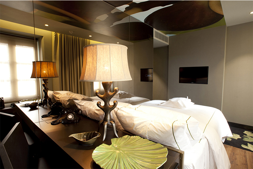 nini andrade silva inserts tree trunk in beautique hotels figueira