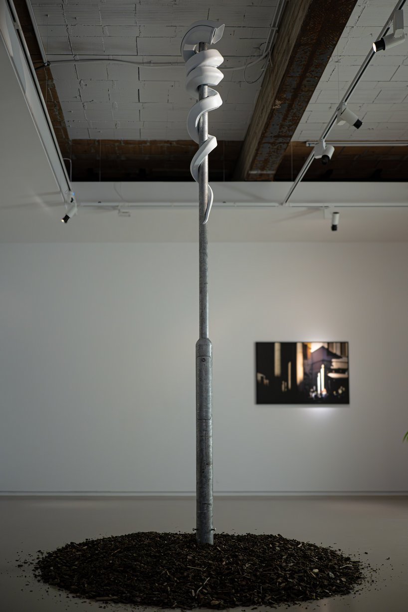 jakub geltner bends surveillance cameras into curved installations for exhibition in belgium