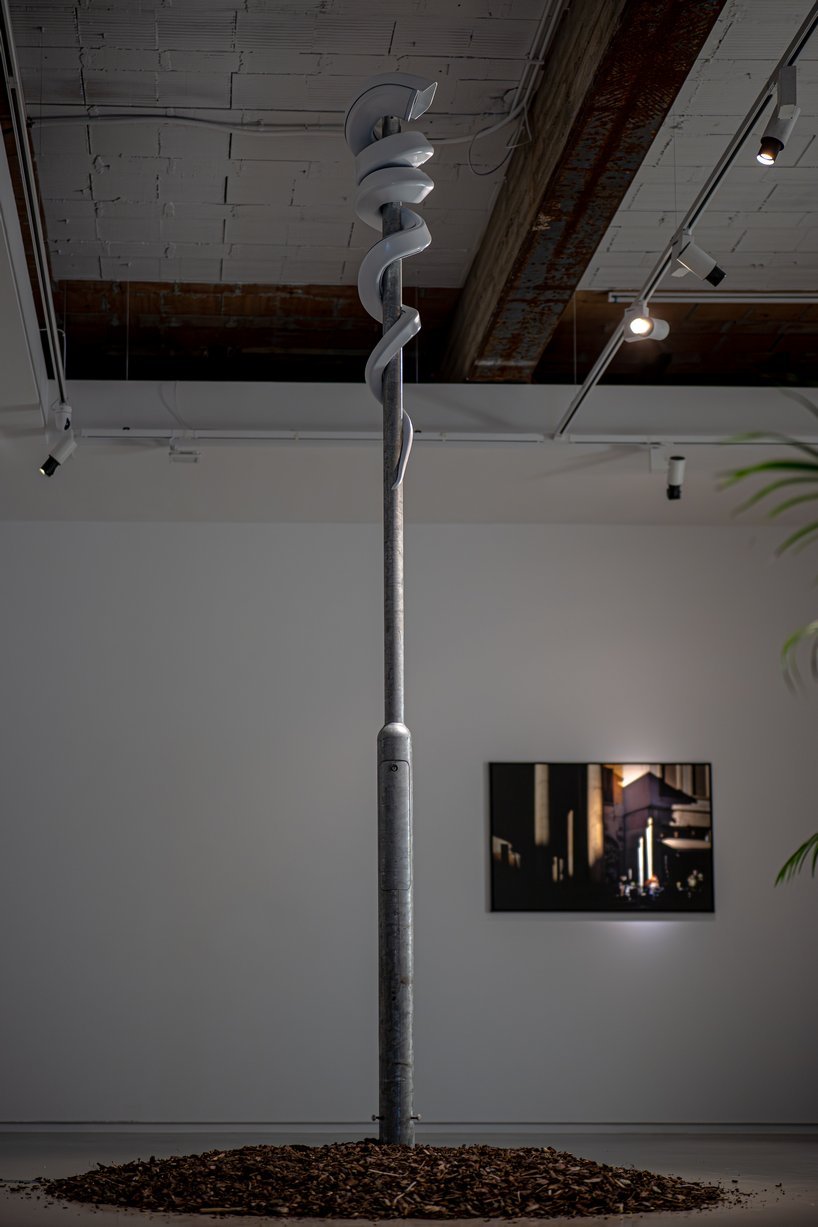 jakub geltner bends surveillance cameras into curved installations for exhibition in belgium