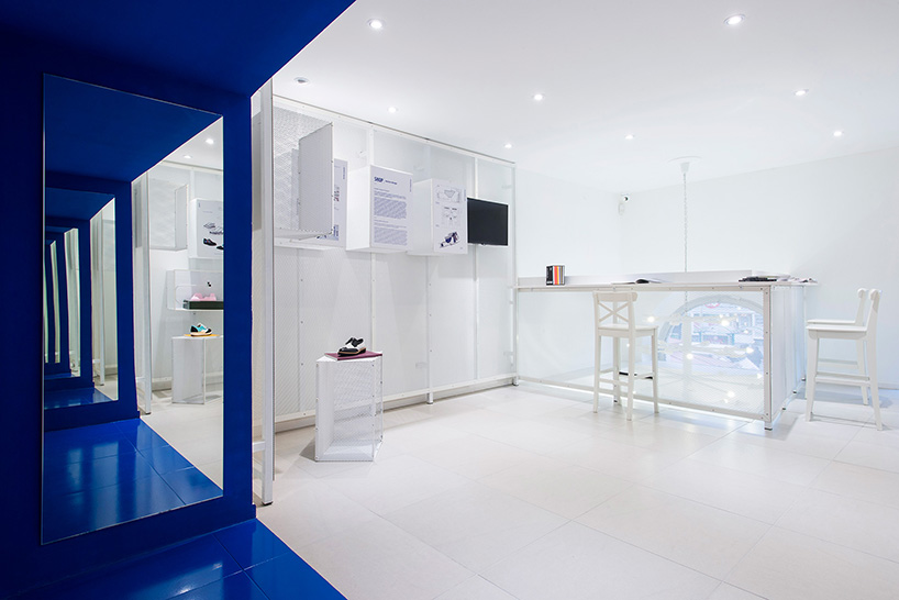 miklós kiss encases budapest footwear store in brilliant white metro tiles