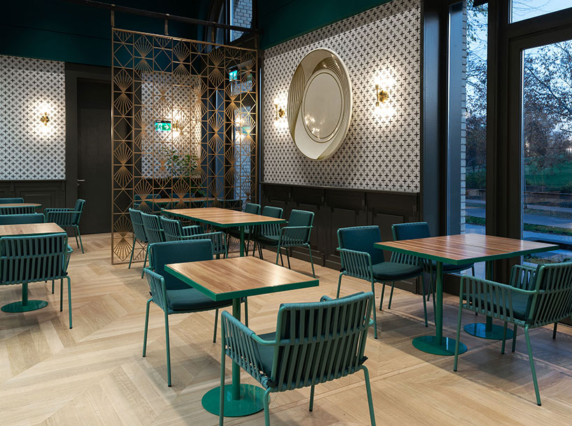 deep green walls adorn the house of millennium restaurant by kissmiklos in budapest