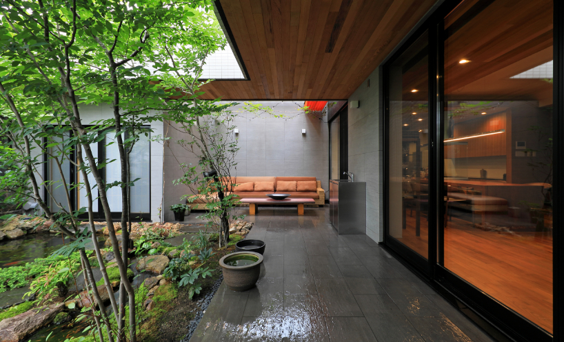 open courtyards embed natural greenery within the living spaces of residence in japan