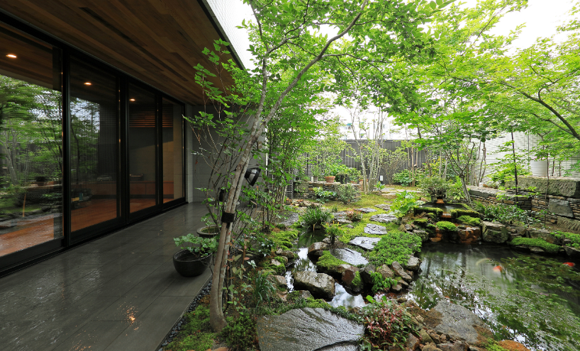 open courtyards embed natural greenery within residence in japan