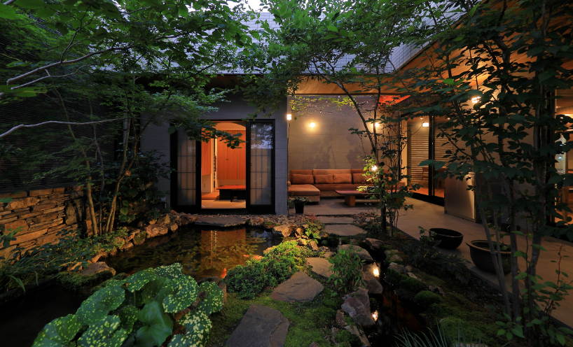 open courtyards embed natural greenery within residence in japan