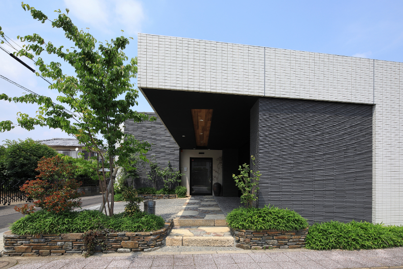 open courtyards embed natural greenery within the living spaces of residence in japan