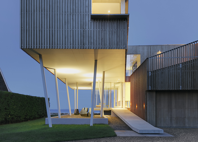 joeb moore + partners reflects coastal landscape in spiral house