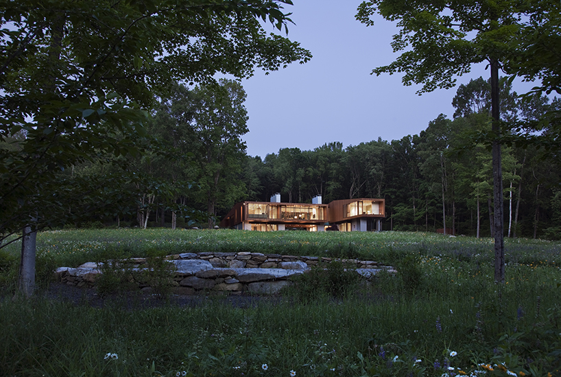 joeb moore + partners spans bridge house over landscape