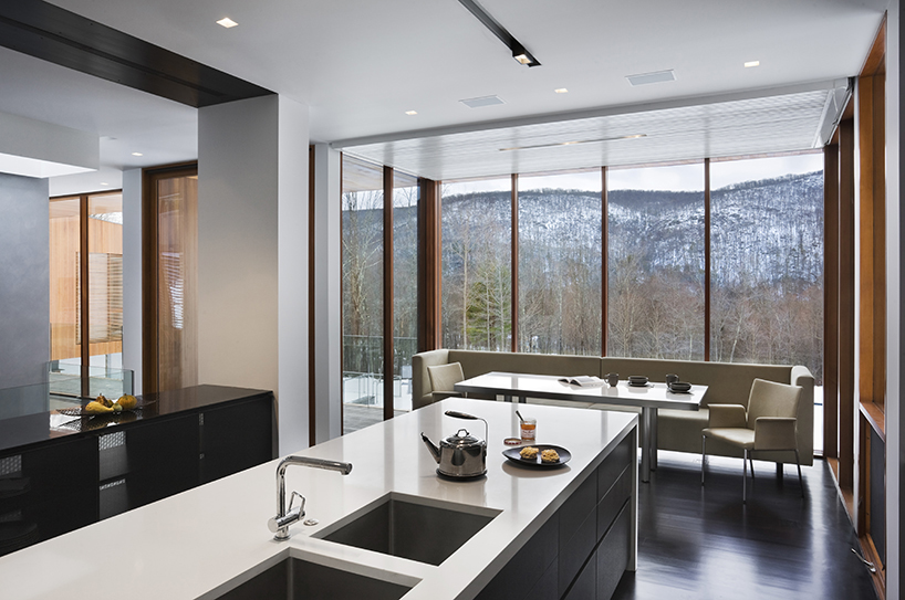 joeb moore + partners spans bridge house over landscape