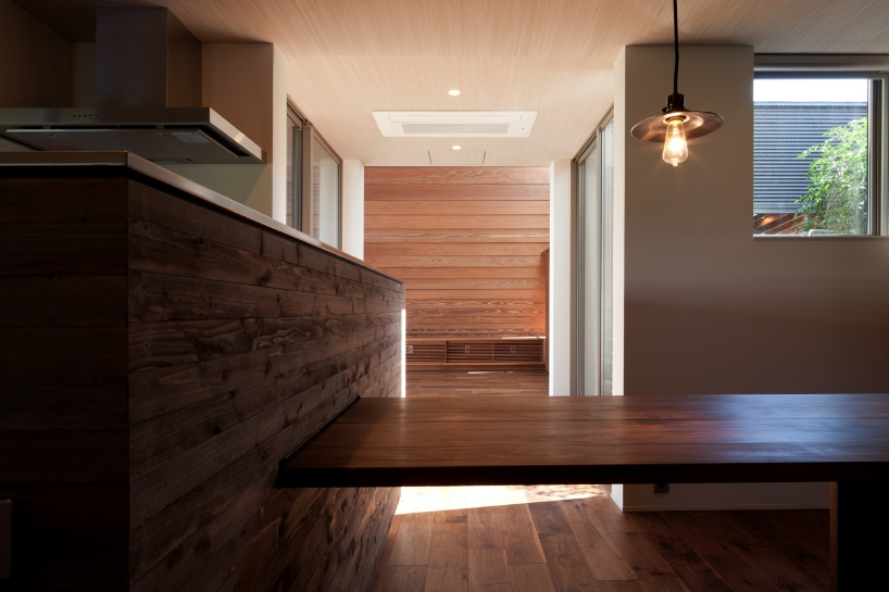 nakasai architects divides house in gankaiji with exterior landscape