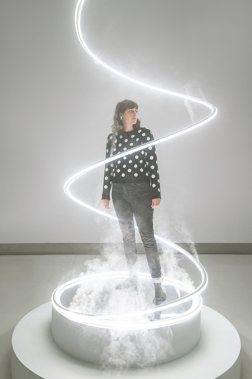 giant spiralling installation by karolina halatek immerses spectators in light + fog