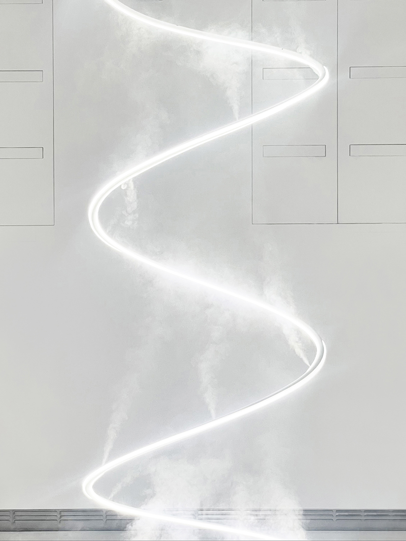 giant spiral installation by karolina halatek immerses viewers in light + fog