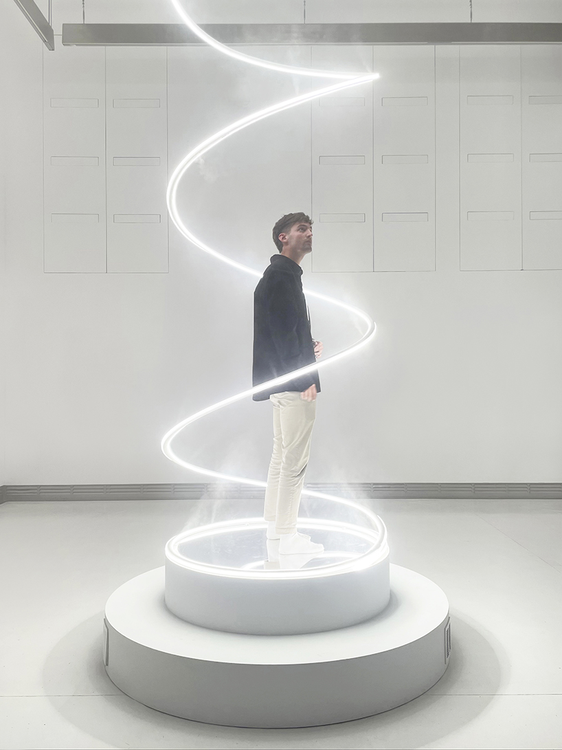 giant spiralling installation by karolina halatek immerses spectators in light + fog