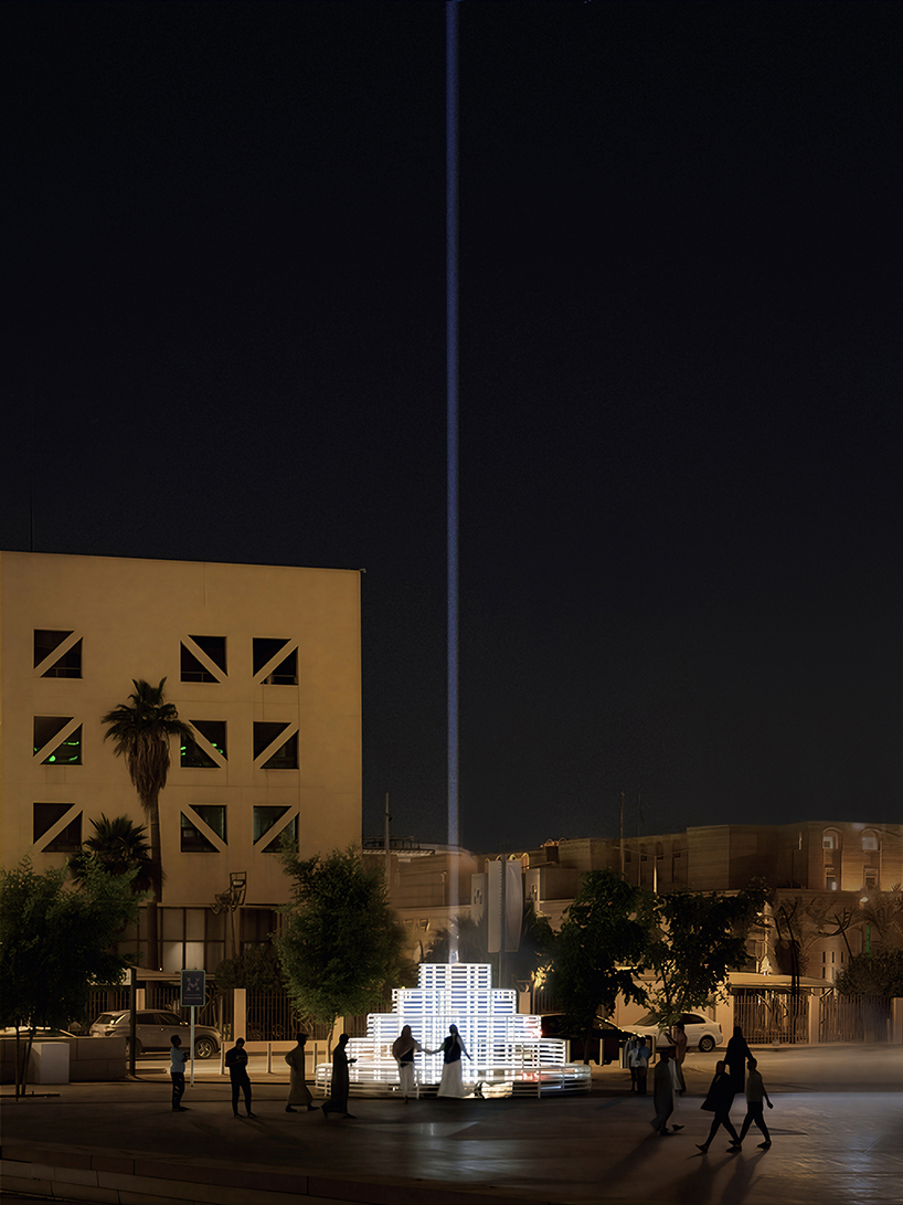 reflective pyramidal monument emits sky-tracing beam of white light in saudi arabia
