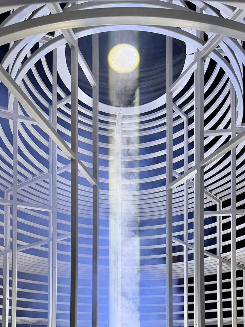 reflective pyramidal monument emits sky-tracing beam of white light in saudi arabia