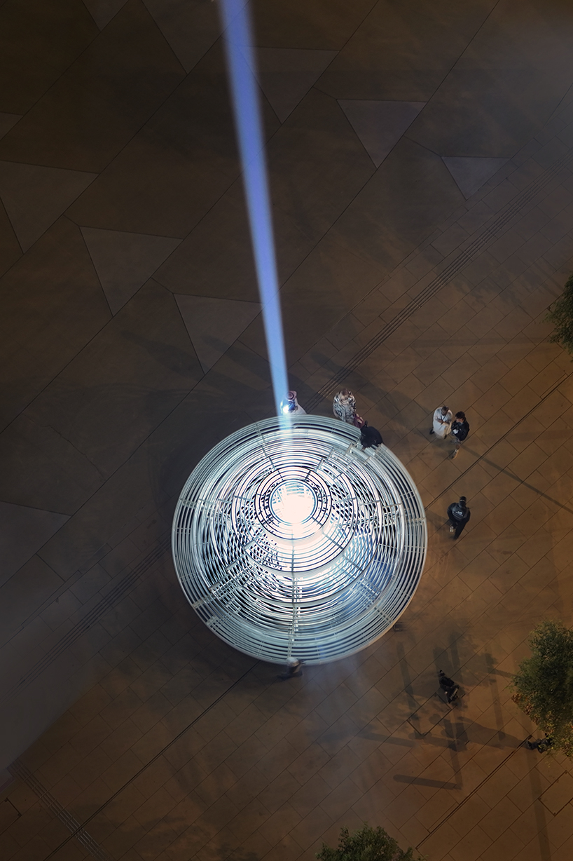 reflective pyramidal monument emits sky-tracing beam of white light in saudi arabia