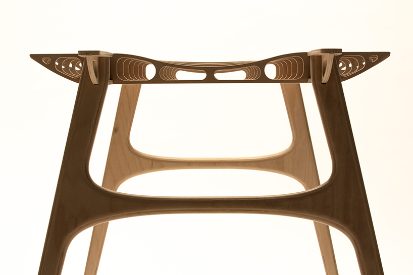 manfred table explores the sculptural structure of wooden airplane wings manfred table francesco frulio stefan lechner and samuele miatello designboom