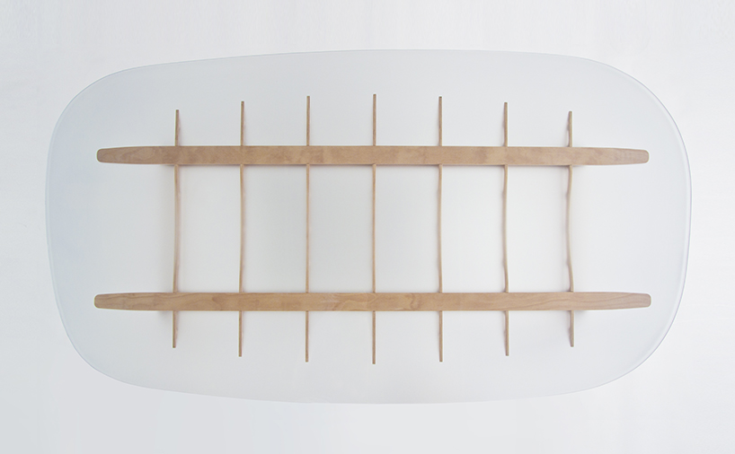 manfred table explores the sculptural structure of wooden airplane wings manfred table francesco frulio stefan lechner and samuele miatello designboom