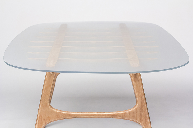 manfred table explores the sculptural structure of wooden airplane wings manfred table francesco frulio stefan lechner and samuele miatello designboom