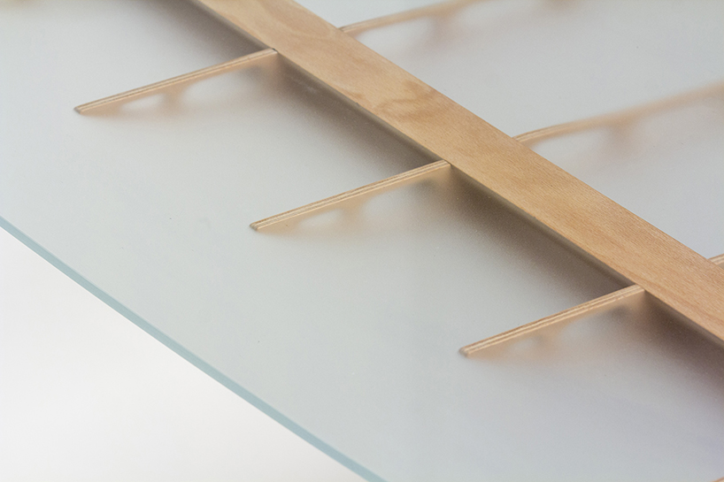 manfred table explores the sculptural structure of wooden airplane wings manfred table francesco frulio stefan lechner and samuele miatello designboom