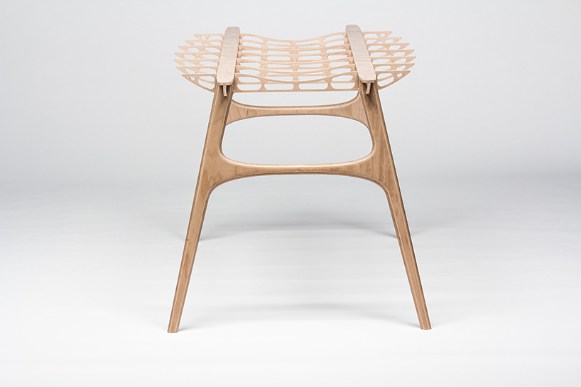 manfred table explores the sculptural structure of wooden airplane wings manfred table francesco frulio stefan lechner and samuele miatello designboom