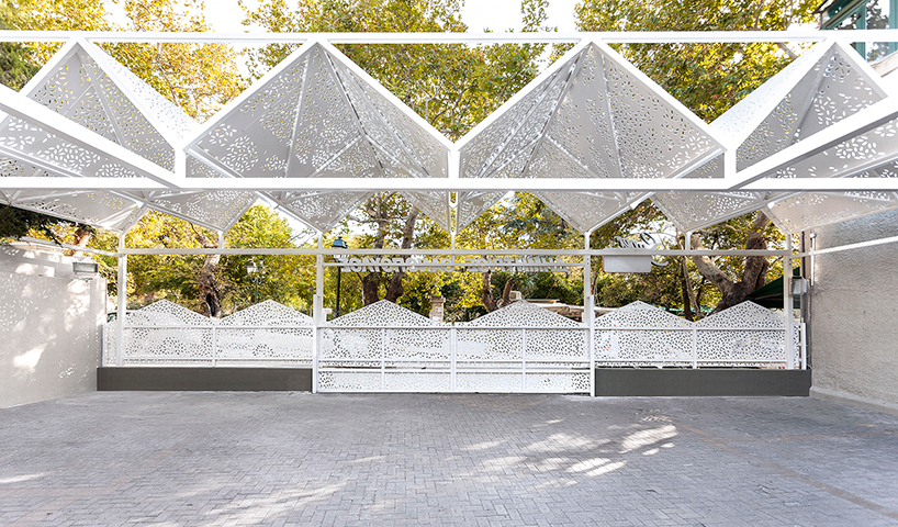 klab architecture's supermarket in athens features a set of gabled roofs