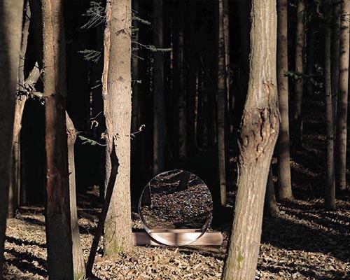 jinsik kim's halfhalf round mirrors distort forested landscapes