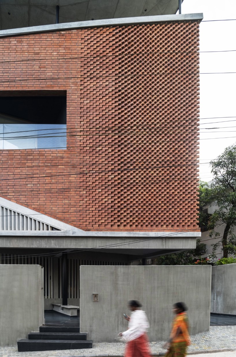 patterned brickwork enfolds multi-leveled residence by purple ink studio in india