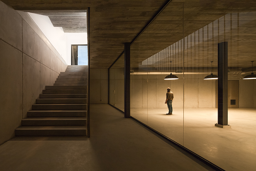 atelier rua wraps a winery pavilion in golden colored metal skin in portugal