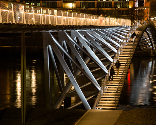 dietmar feichtinger architectes curves peace footbridge over river in lyon