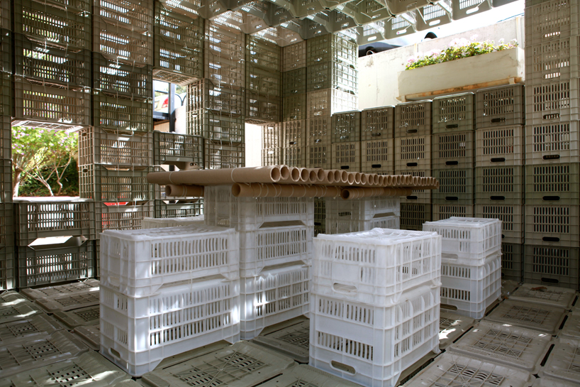 LAU architecture students assemble emergency shelter with plastic crates + ties