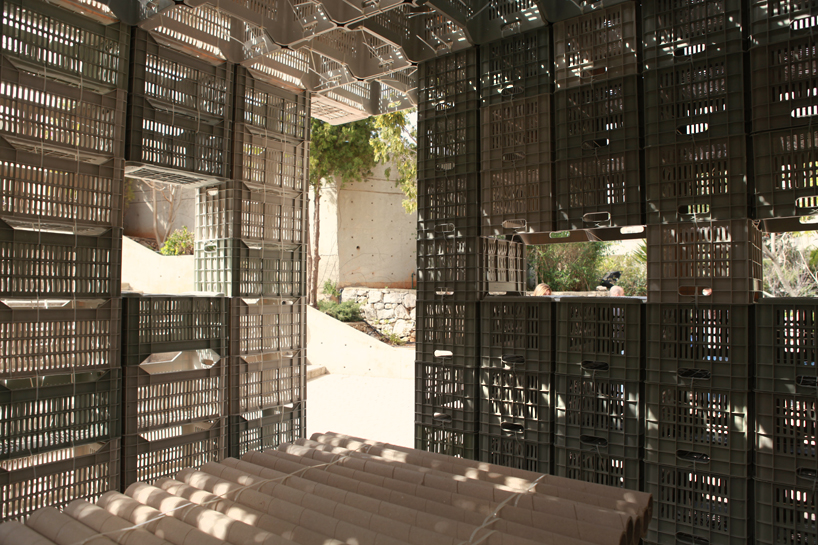 LAU architecture students assemble emergency shelter with plastic crates + ties