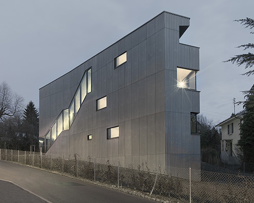 LOCALARCHITECTURE covers rovereaz housing with corrugated skin in lausanne