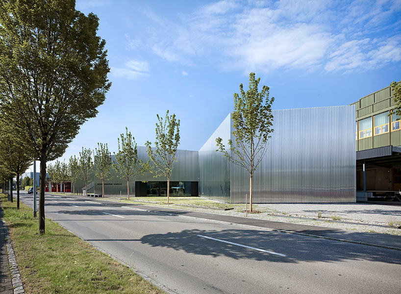 kit architects' fire station in switzerland rises as a cultivated industrial building