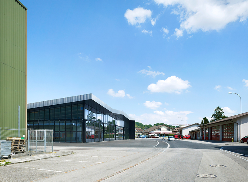 kit architects' fire station in switzerland rises as a cultivated industrial building