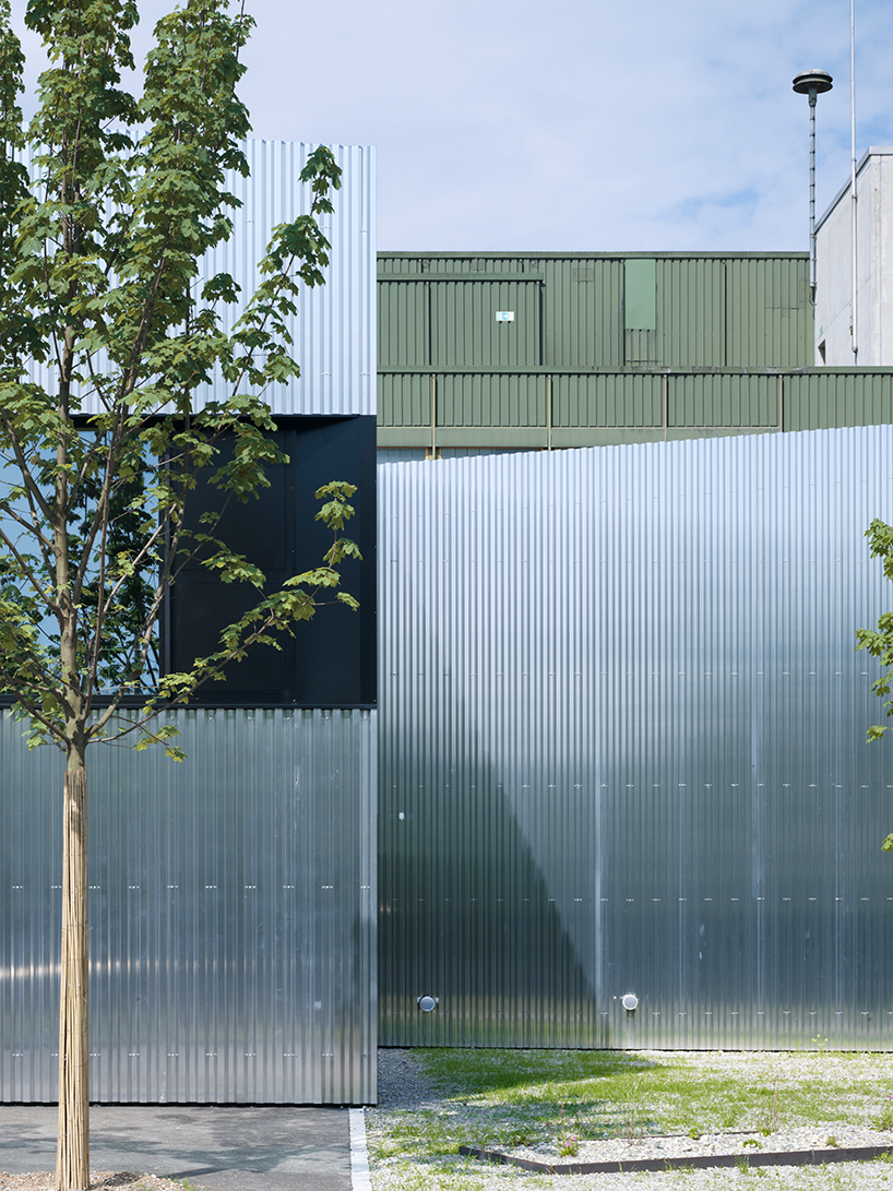 kit architects' fire station in switzerland rises as a cultivated industrial building