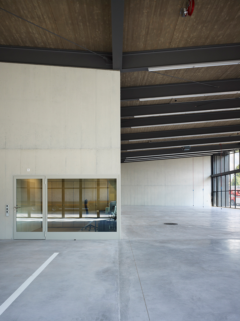 kit architects' fire station in switzerland rises as a cultivated industrial building