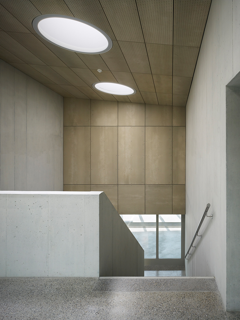 kit architects' fire station in switzerland rises as a cultivated industrial building