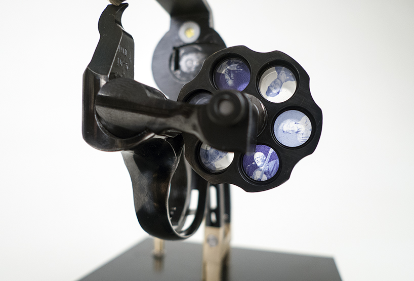 artist constantine zlatev transforms a revolver into a slide projector in tribute to nonviolent resistance