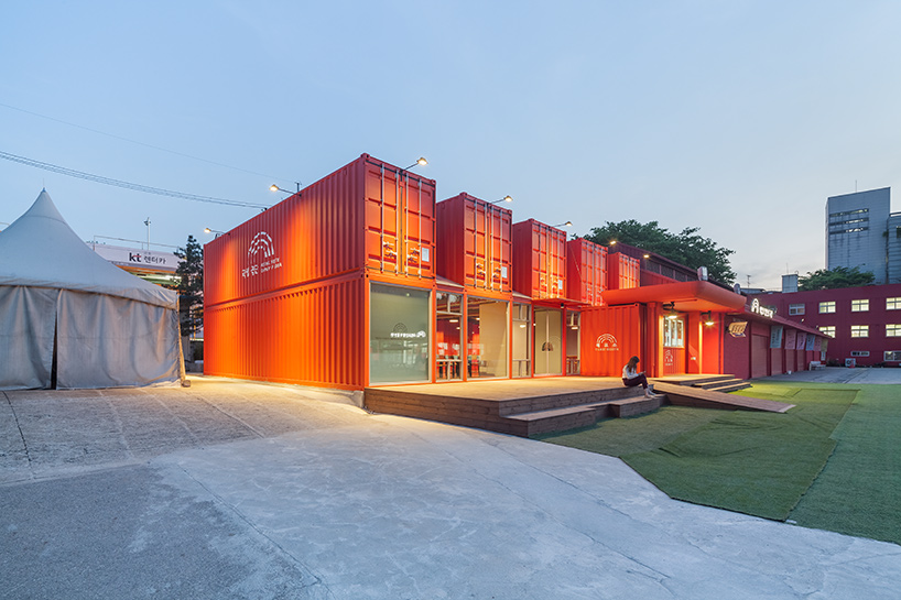 URBANTAINER extends the national theater company of korea with modulated red shipping containers