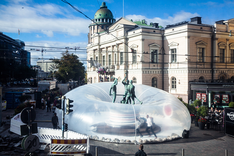 plastique fantastique inflates bubble around landmark in helsinki