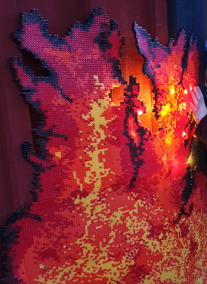 UMA installs a spectacular fire-like lighting system in a swedish forest