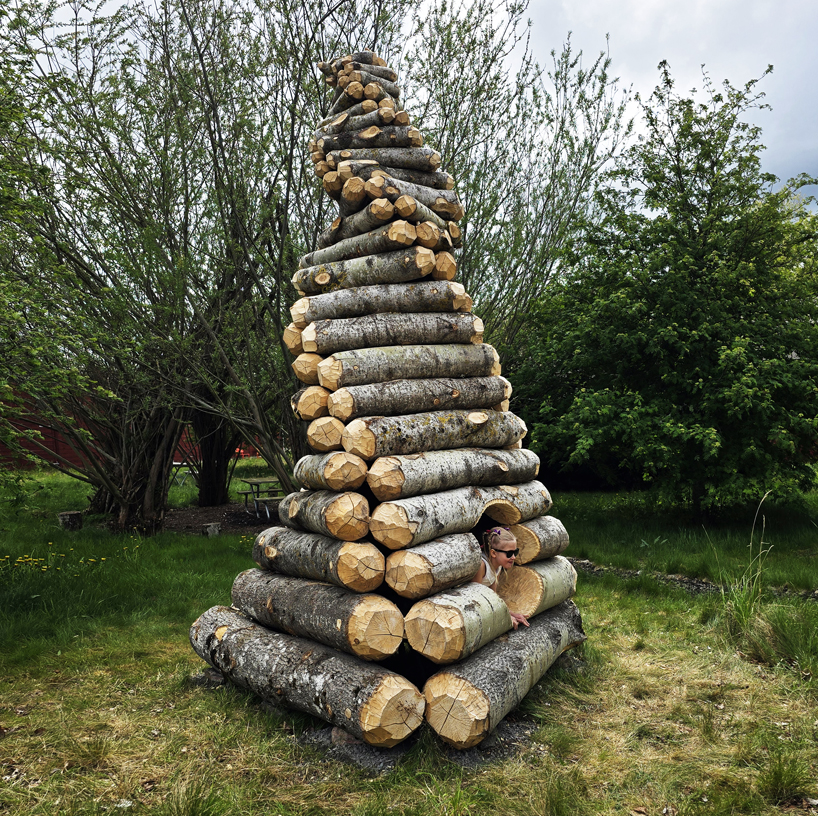 timber twist by ulf mejergren and travis child reimagines larvae shelter as spiraling log cabin