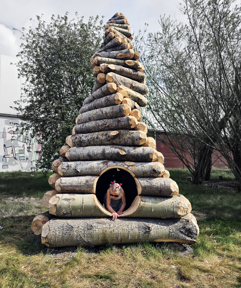 timber twist by ulf mejergren and travis child reimagines larvae shelter as spiraling log cabin