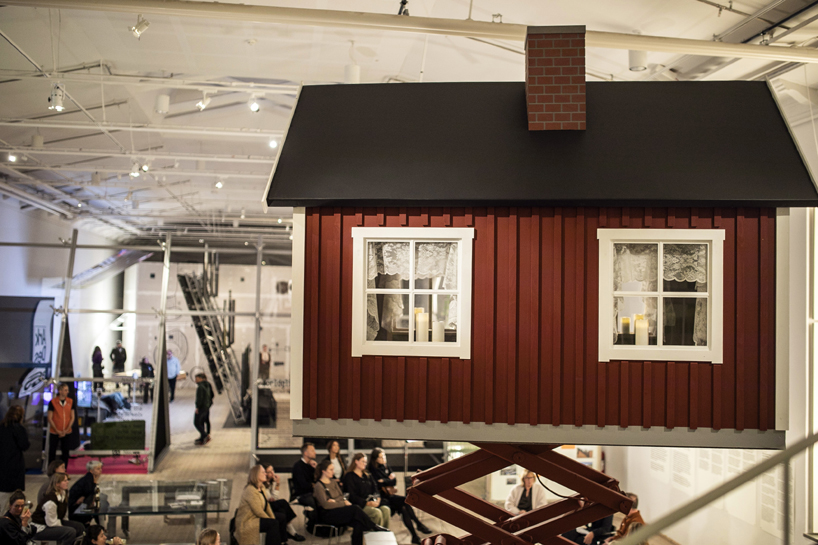ulf mejergren builds mobile red cottage on scissor lift as a response to climate change