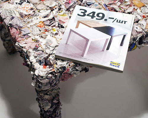 a table made from every single page of an IKEA catalogue