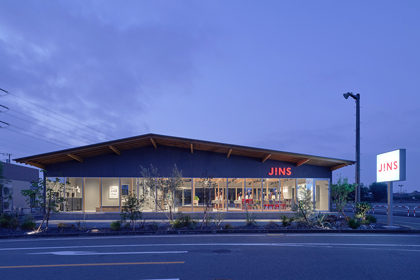 gentle gable roof overcasts wooden frame of eyewear store in japan