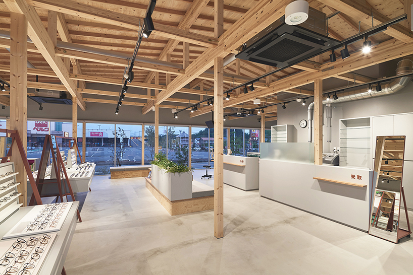 gentle gable roof overcasts wooden frame of eyewear store in japan